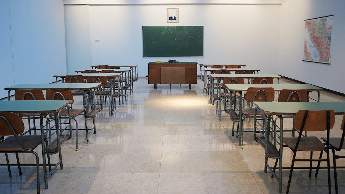 Interior of a classroom with rows of desks