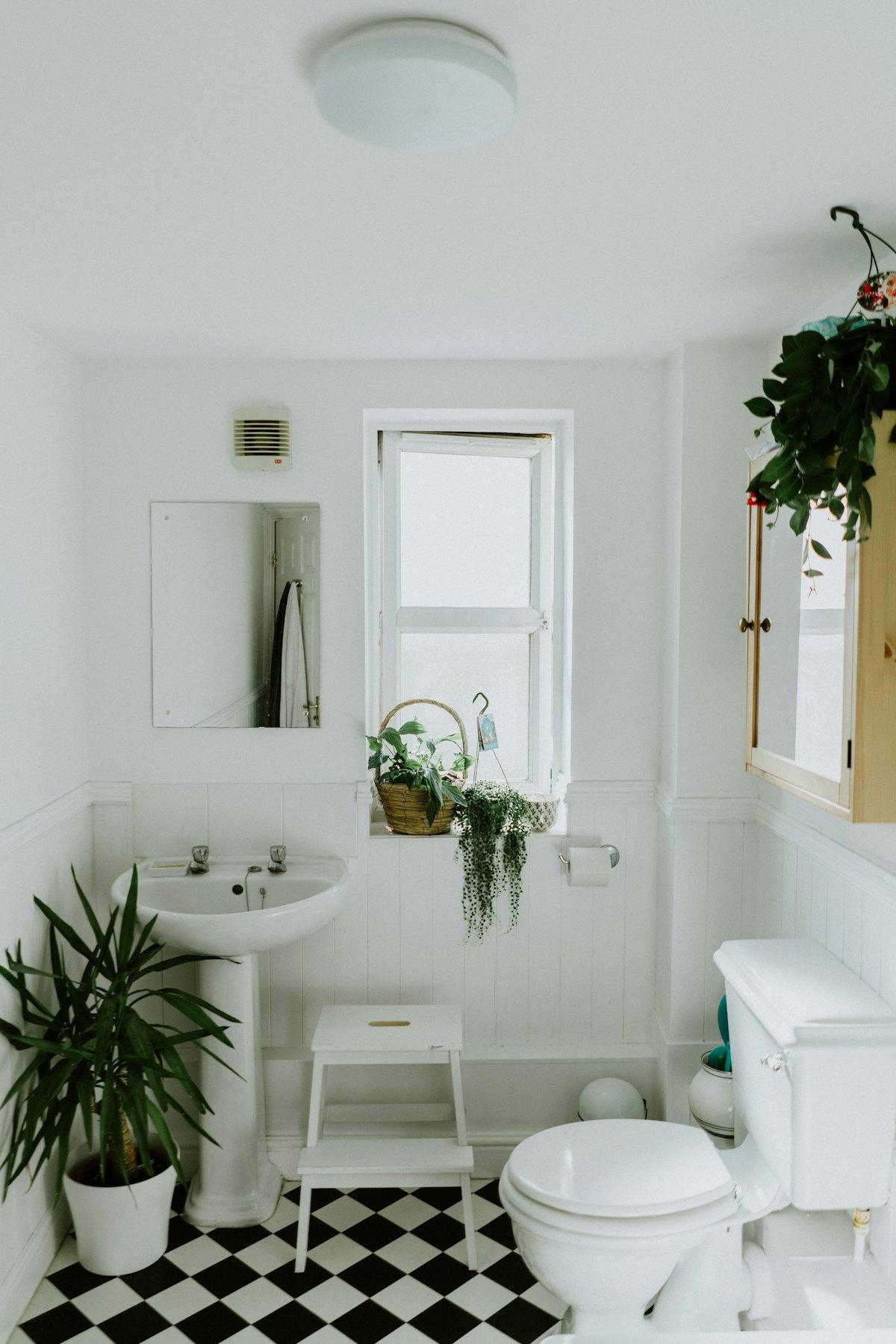Clean, simple washroom with basin and window